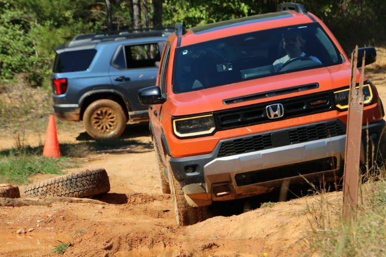 2026 Honda Passport TrailSport front 3/4 view off-roading at OEX in North Carolina