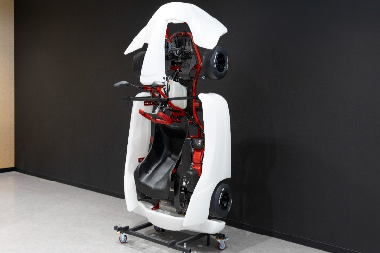 A Toyota GR Kart being stored upright