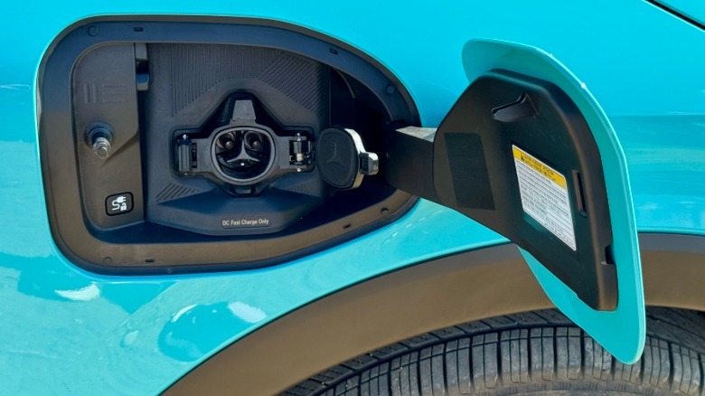 A close-up of the Leaf's NACS port on the passenger side