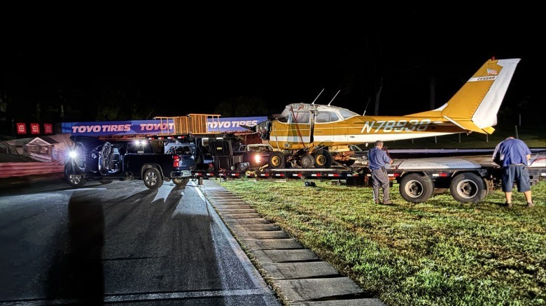 A crashed Cessna 172 partly dismantled and loaded on a trailer for removal from Lime Rock Park