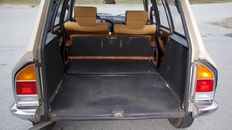 the Citroen with the trunk open showing the flat load floor