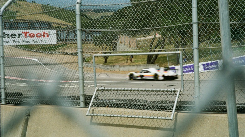 A film photo of a Porsche 963 at Laguna Seca
