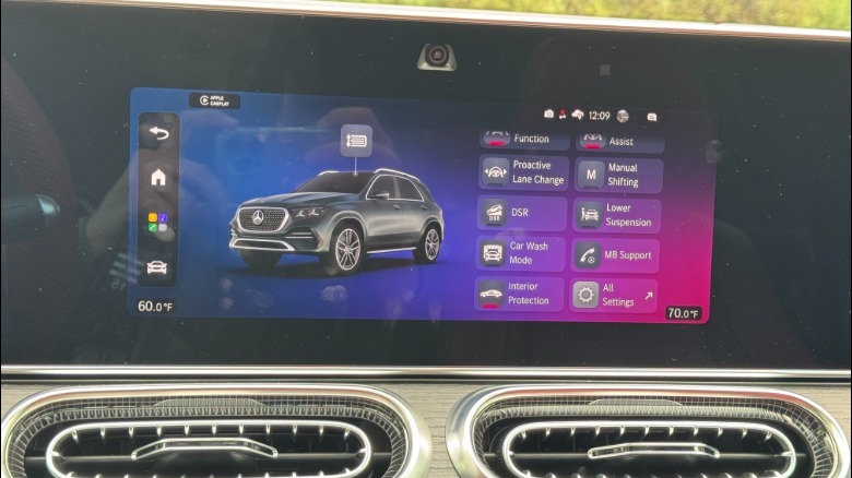 A close-up shot of the center infotainment screen with the 'quick controls' menu pulled up with lots of small menu options
