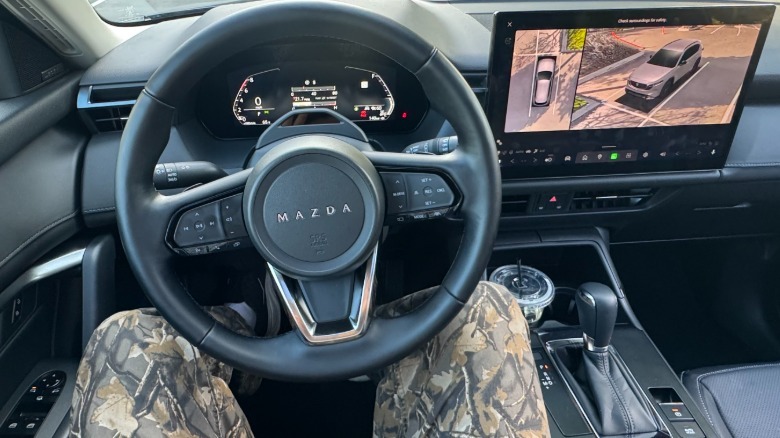 A photo of the driver's POV in the CX-5 with the surround view camera up on the screen