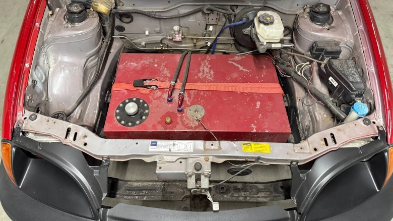 Underhood view of a mid-engine V8-swapped Geo Metro showing a fuel cell