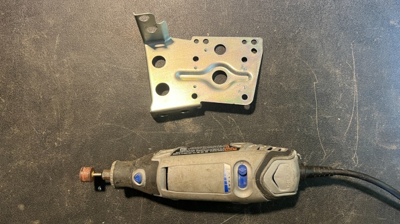 A modified Toyota 4Runner head unit bracket and the Dremel I used to modify it