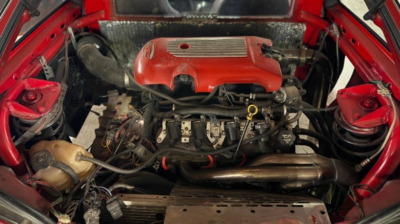 Engine compartment of a Geo Metro with a mid-engine V8 LS swap