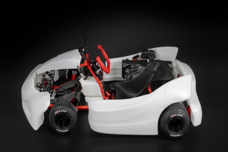 The side profile of a white Toyota GR Kart