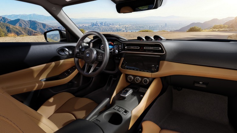 A wide shot looking from the passenger seat showing the new tan interior color option