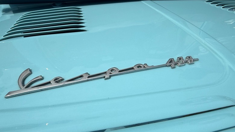 The Vespa 400 lettering on the trunk of the car.