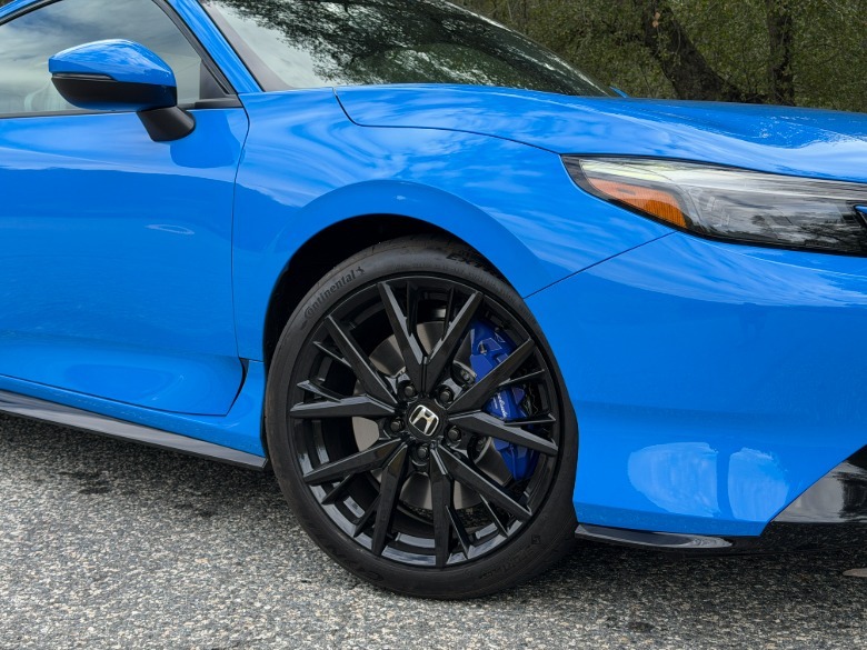 Front wheel of a blue 2026 Honda Prelude