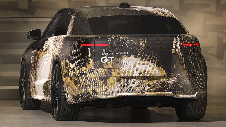 Rear 3/4 view of a camouflaged Range Rover GT prototype