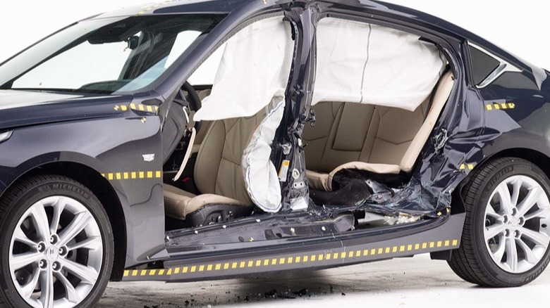 A photo of the side of the CT5 that was T-boned in the test with the doors removed to show the structural damage