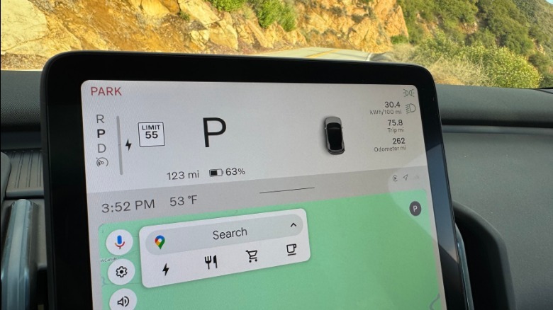 A close-up of the center mounted screen showing the teeny tiny trip information