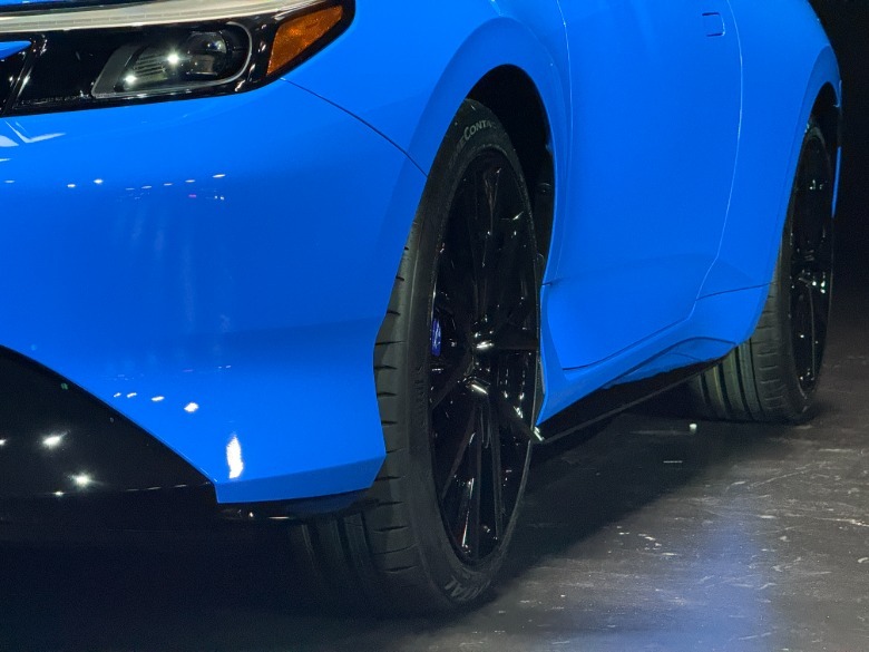 Front fender of a blue 2026 Honda Prelude