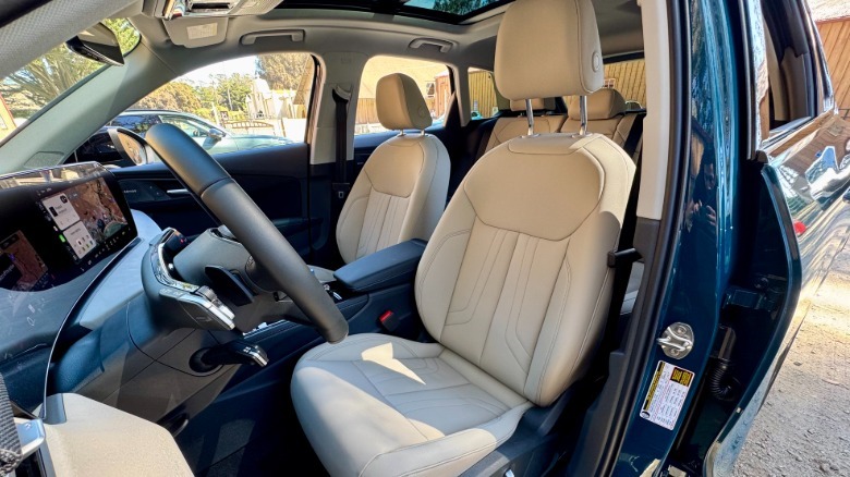 A look through the driver's door on the new Q3 showing the white leather seats and panoramic sunroof