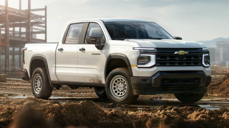 Front 3/4 view of a white 2027 Chevrolet Silverado 1500 Work Truck