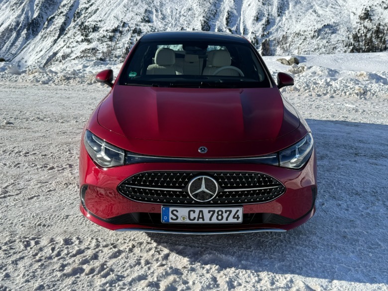 head-on view of a red 2027 Mercedes-Benz CLA220 4Matic hybrid