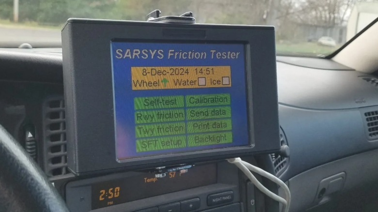 A photo of the SARSYS Friction Tester dashboard-mounted touchscreen control unit