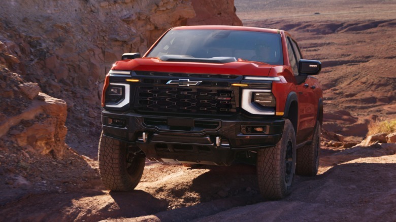 A red 2027 Chevrolet SIlverado 1500 ZR2 Bison off-roading