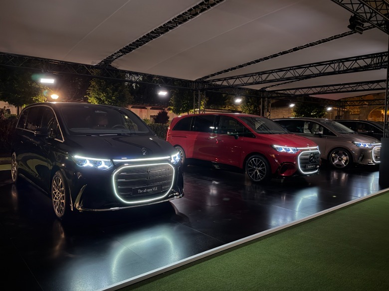 Three Mercedes-Benz VLEs with the lights on
