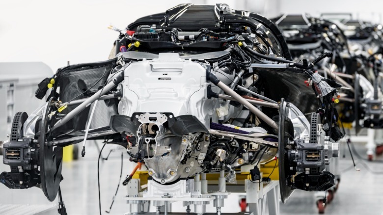 A photo of the rear of a Valkyrie chassis with no body panels showing the rear subframe assembly in the factory