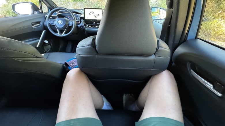 A photo of my POV from the passenger-side rear seat showing how squished I am
