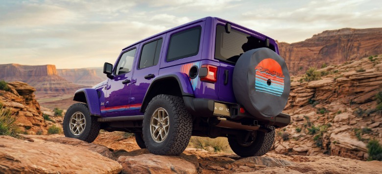 Rear 3/4 view of a purple Jeep Wrangler Rewind