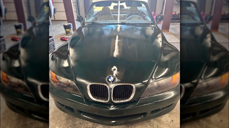 Front view of a BMW Z3 with a poor green paint job