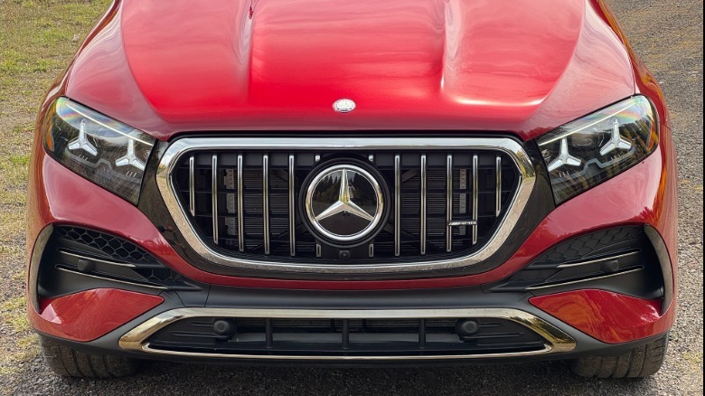 A close-up shot of the nose of the red GLE53 Coupe parked on gravel