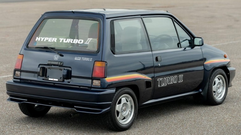rear three-quarters shot of the perfect dark blue Honda City Turbo II showing the big hyper turbo II rear window graphic