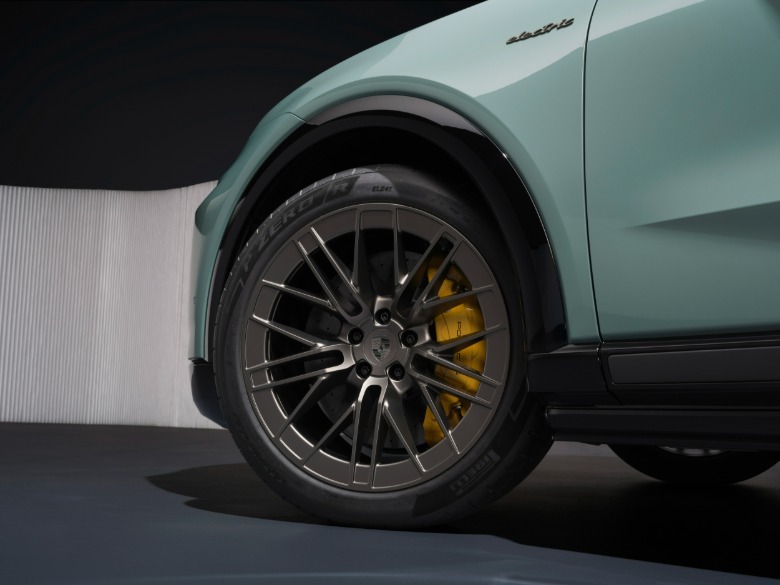 Front wheel of a green 2026 Porsche Cayenne Turbo Electric