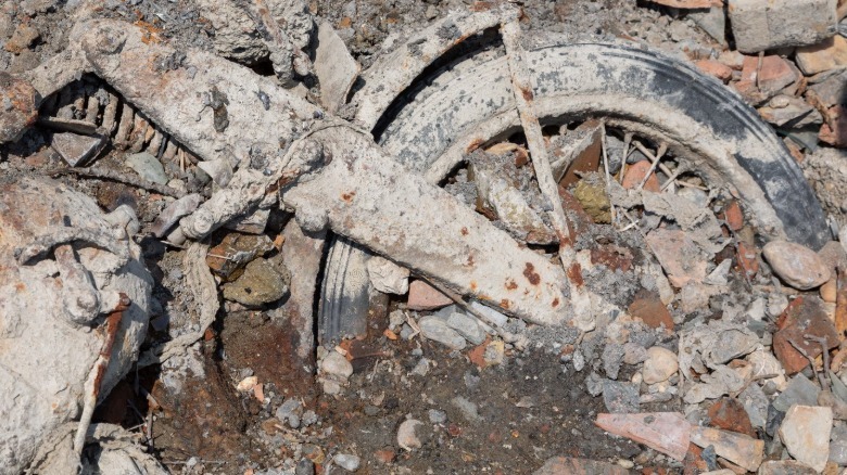 A bike part-submerged in mud