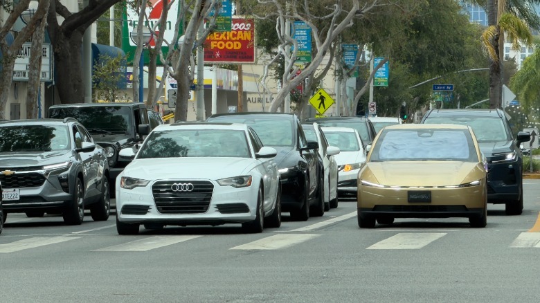 A Tesla Cybercab in traffic