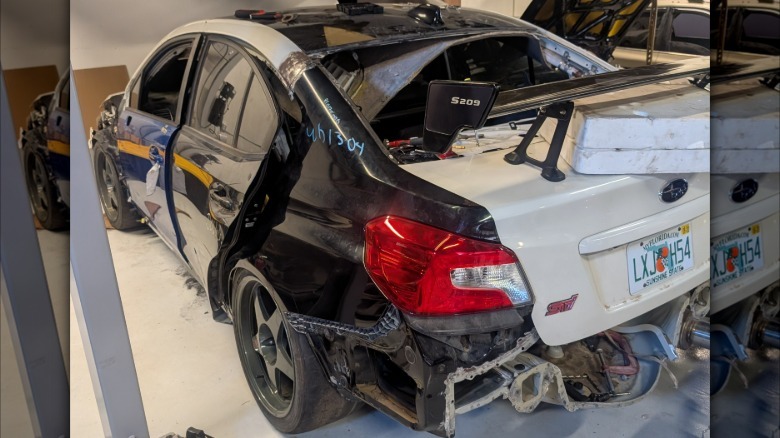 Rear 3/4 view of repair work in progress on Ryan Stewart's Subaru WRX STI S209