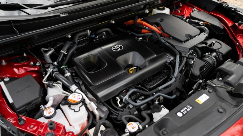 A look under the hood of the red RAV4 GR Sport showing its gas engine