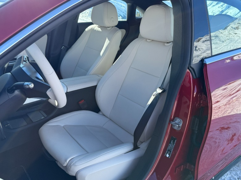 front seats of a red 2027 Mercedes-Benz CLA220 4Matic hybrid