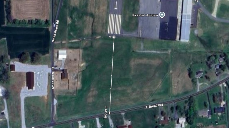 Google Map showing about a 600-foot buffer between the end of the runway and the road