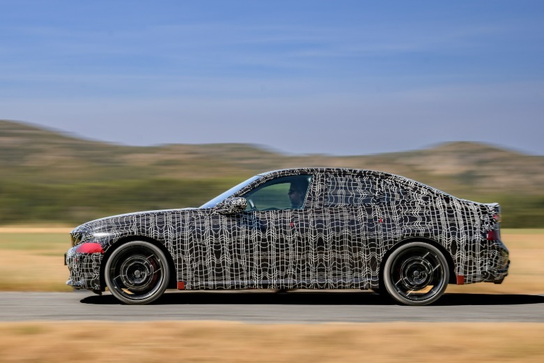 Side view of a camouflaged BMW M350 prototype