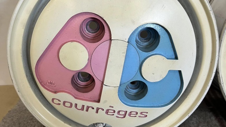 A close-up of the wheel showing the pink and blue A C letters