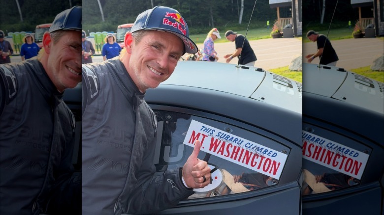 Scott Speed gives a thumbs up while standing next to Project Midnight