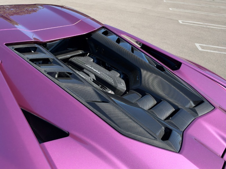 Engine bay of a pink Lamborghini Revuelto