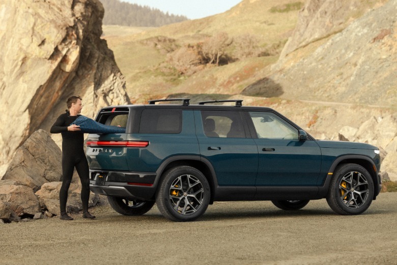 Rear 3/4 view of a blue Rivian R2