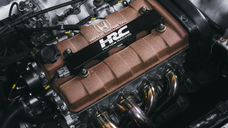 A close-up of the sparkly clean engine and its stainless-steel headers