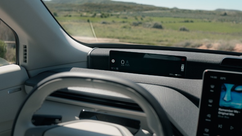 The digital dash mounted beneath the windshield of a 2027 Volvo EX60