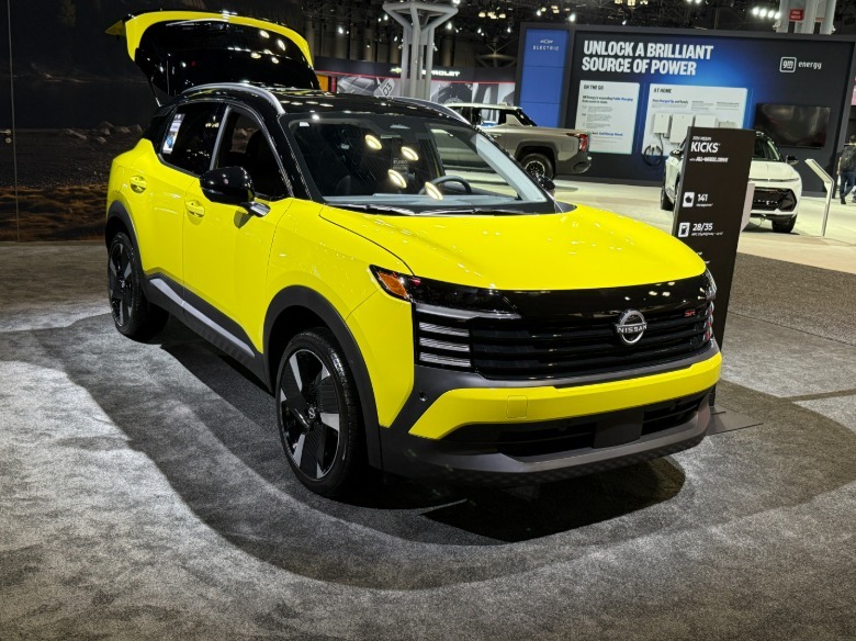 Front 3/4 view of a yellow Nissan Kicks at the New York Auto Show