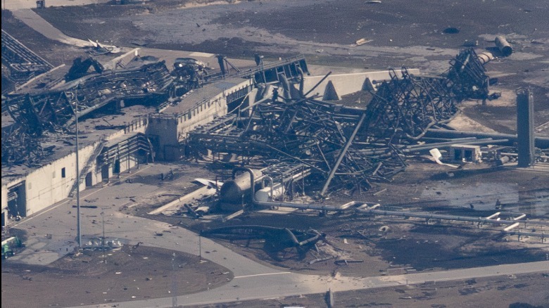 Aerial view of the collapsed transporter erector and lightning tower at Launch Complex 36